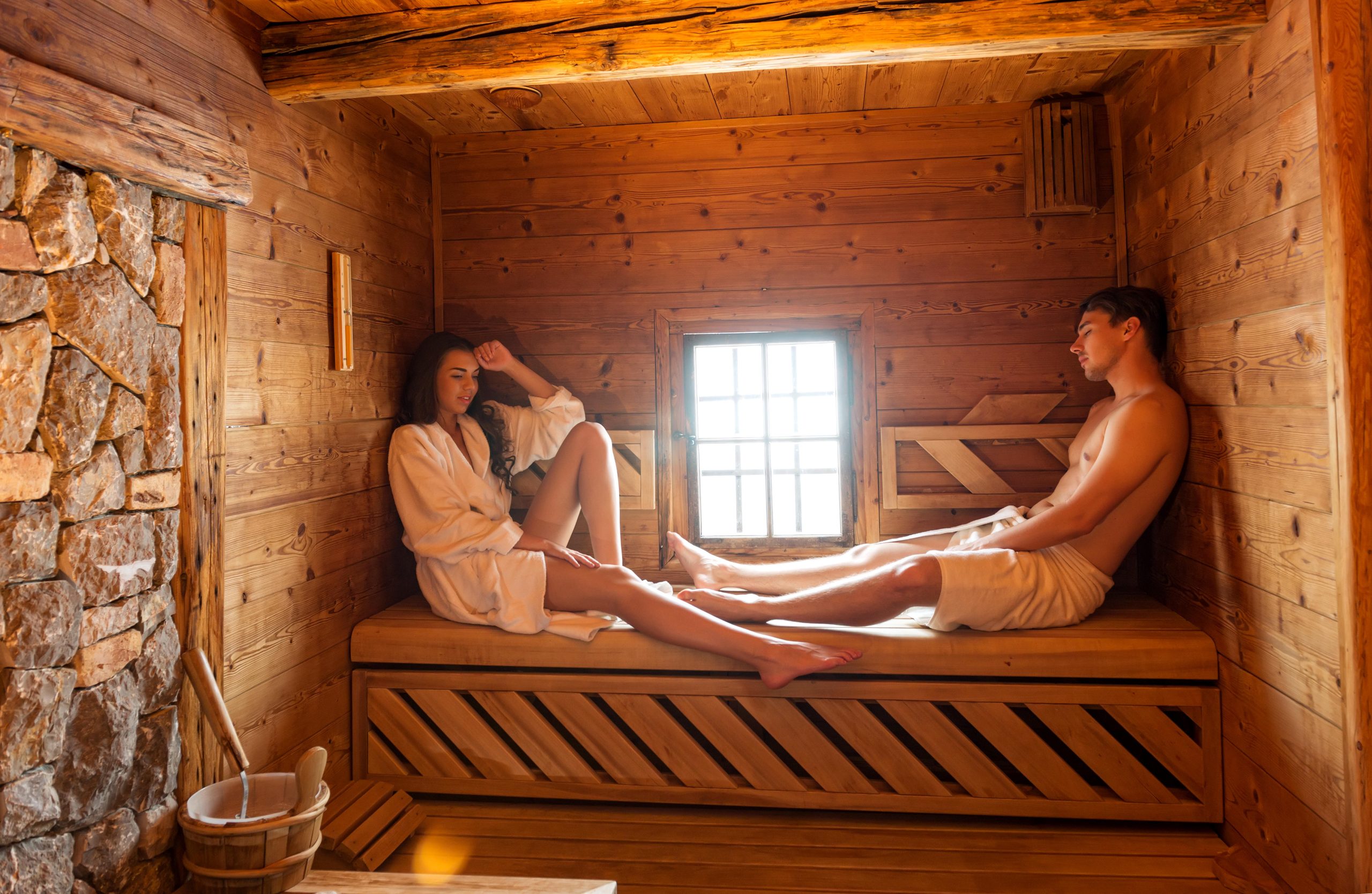Young couple in sauna