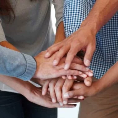 Hands stack, business people and team building together for collaboration meeting, goals and company target motivation. Diversity, excited and startup group of people with stack hand sign for mission.
